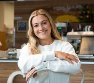 Corinne, co-founder of Goodness Bowls, smiling in the cafe.