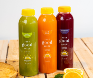 Three colorful bottles of Goodness Bowls cold-pressed juices.