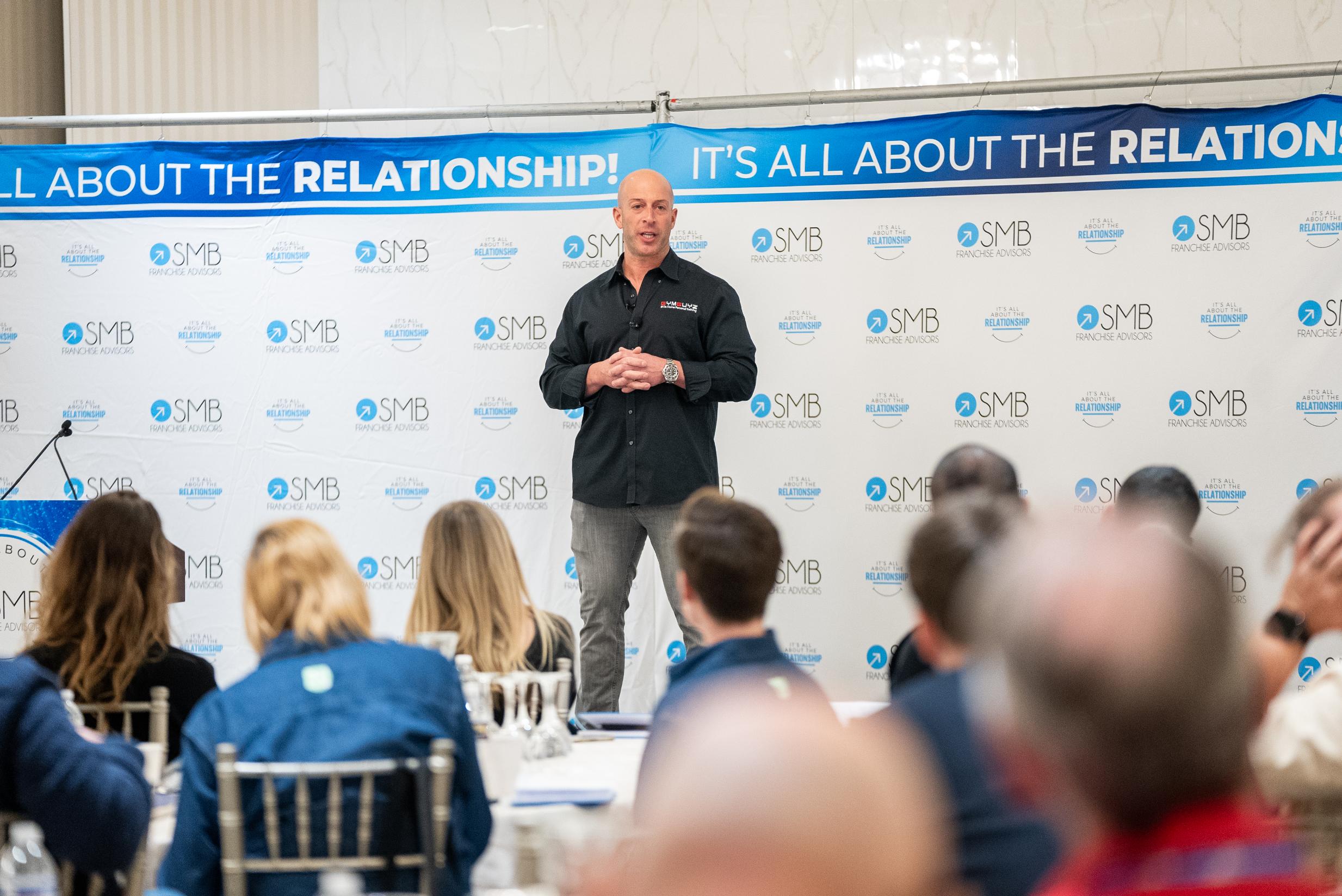 Business speaker sharing insights at SMB Franchise Advisors event - SMB Franchise Advisors