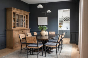 Modern dining room with wooden furniture and dark walls
